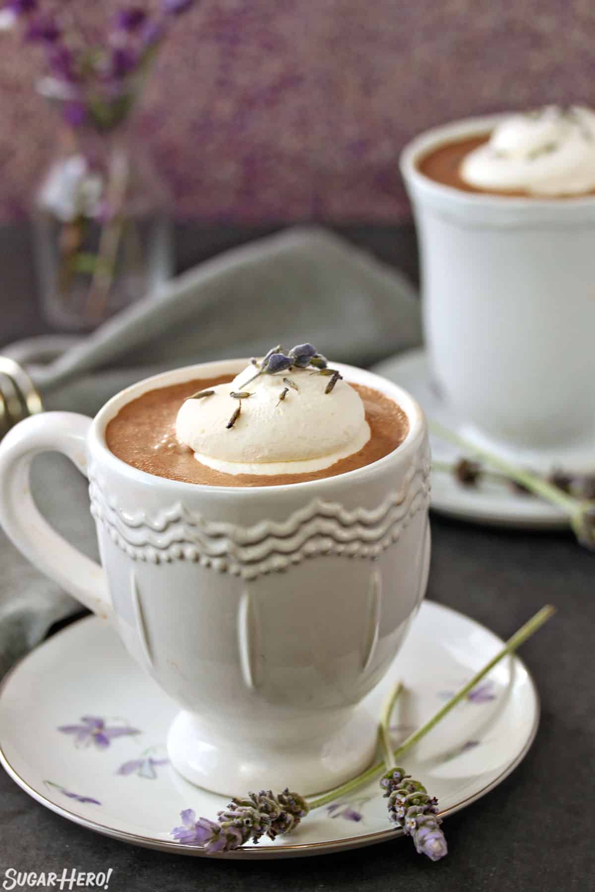 Lavender Hot Chocolate | SugarHero.com Close up of a white mug of Lavender Hot Chocolate.