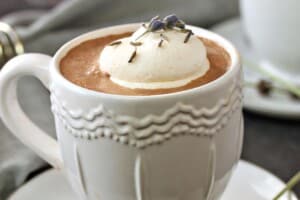 Photo of Lavender Hot Chocolate with text overlay for Pinterest.