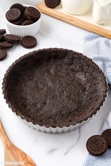 Close up of an Oreo Pie Crust in a silver pie pan.