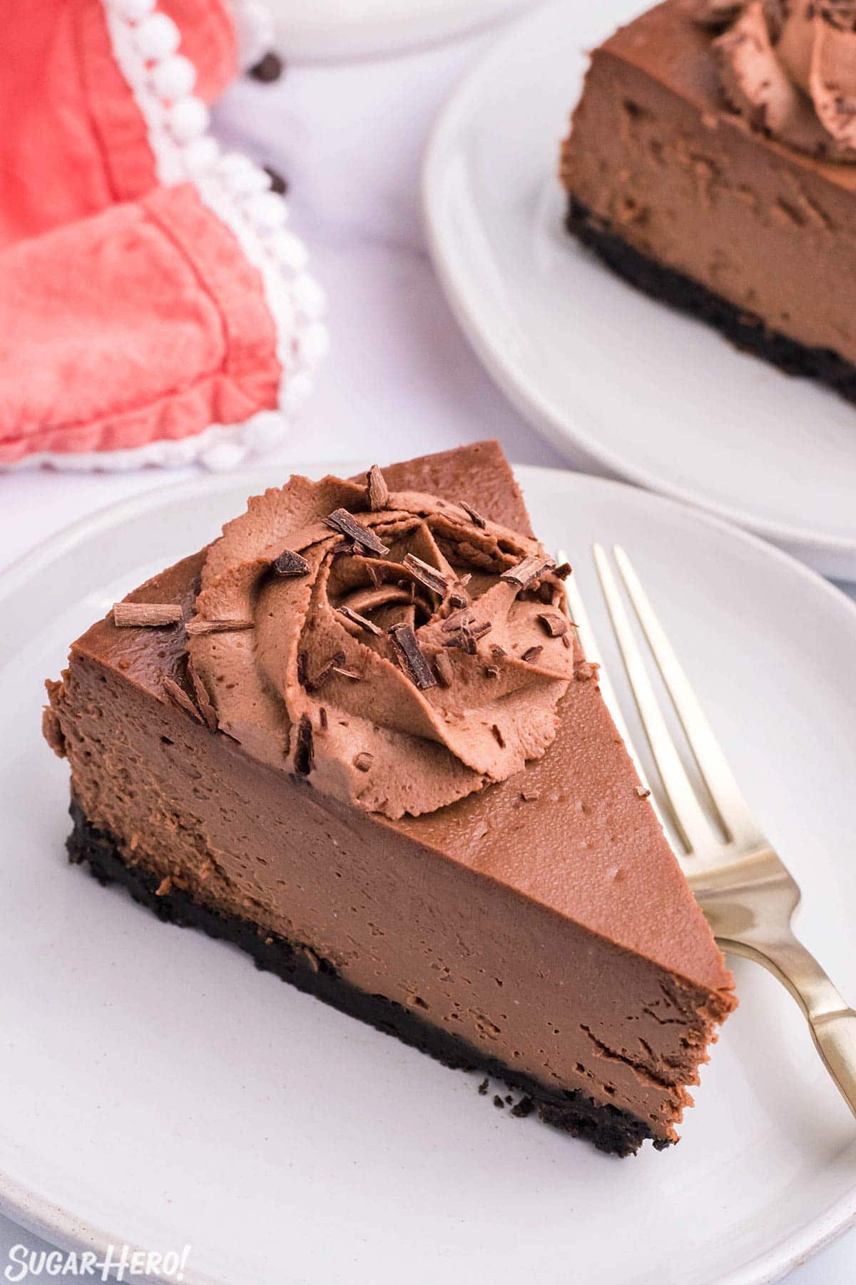 A slice of Chocolate Cheesecake on a white plate.