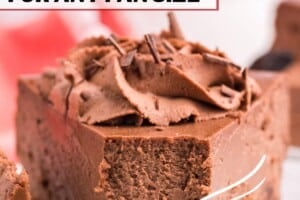 A photo of chocolate cheesecake with an oreo crust with text overlay for Pinterest.