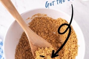 Picture of a white bowl filled with graham cracker crust mixture, with text on top for Pinterest.