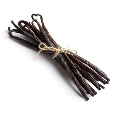 Group of vanilla beans tied with brown twine.