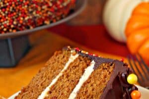 Photo of a slice of Pumpkin Layer Cake with text overlay for Pinterest.