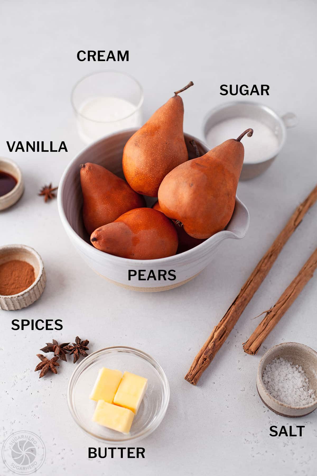 Ingredients needed to make Poached Pears with labels.