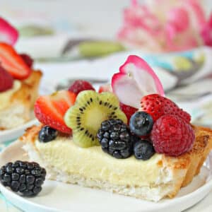 A slice of Coconut Macaroon Tart on a white jplate.