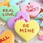 Close up of several stacked Conversation Heart Sugar Cookies.