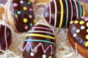 Image of Easter Egg Doughnuts with text overlay for Pinterest.