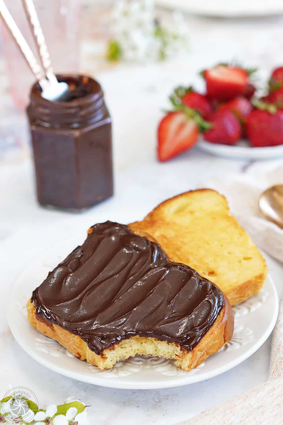 A slice of toast covered with Chocolate Spread.
