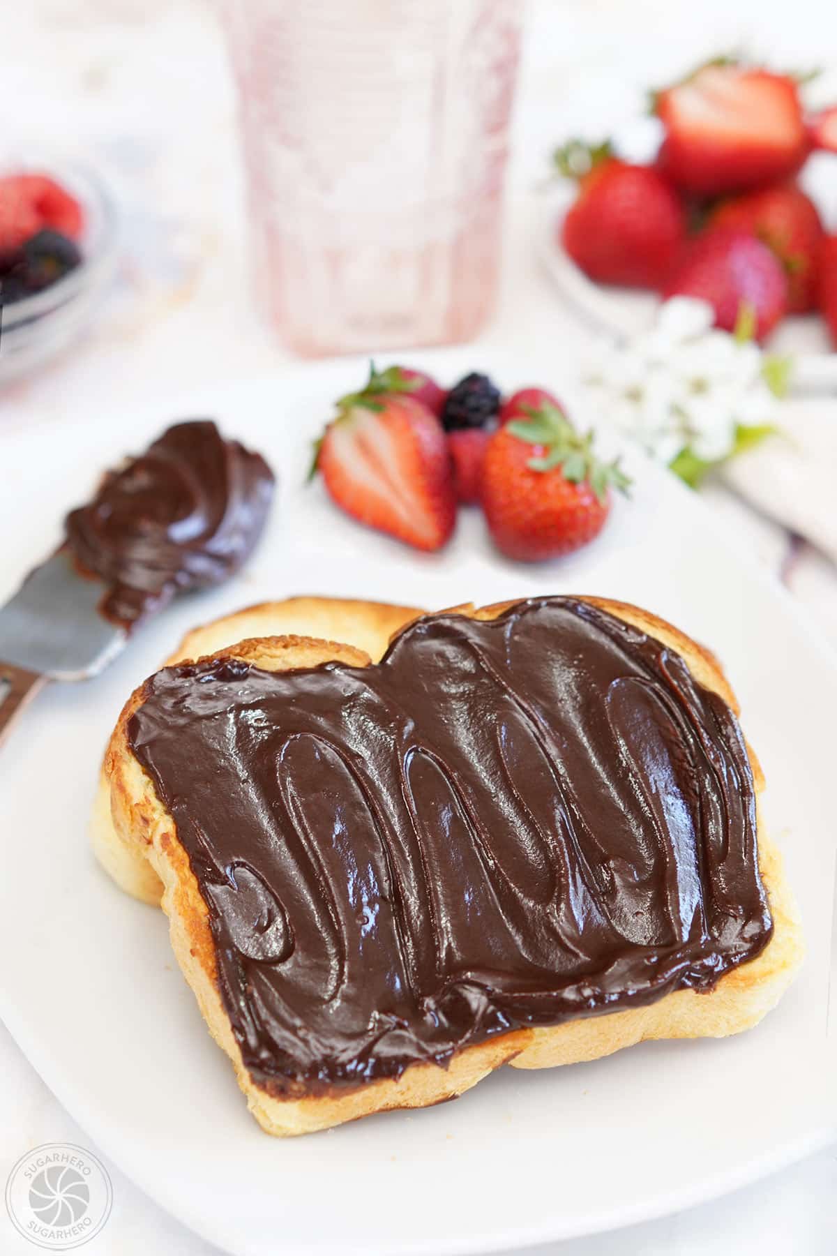 A slice of toast covered with Chocolate Spread.