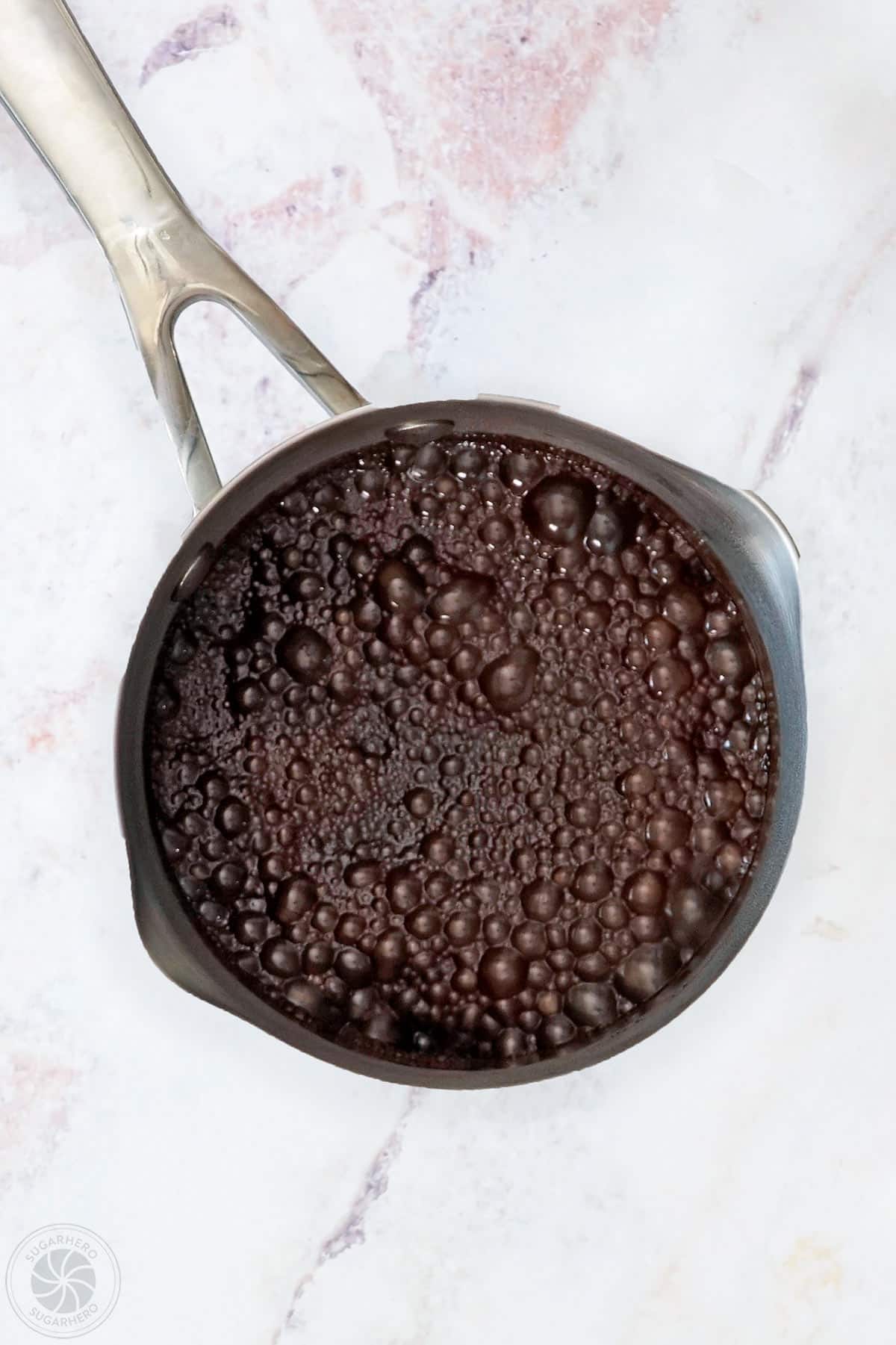 A simmering saucepan with chocolate spread ingredients.