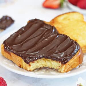 A piece of toast spread with chocolate.