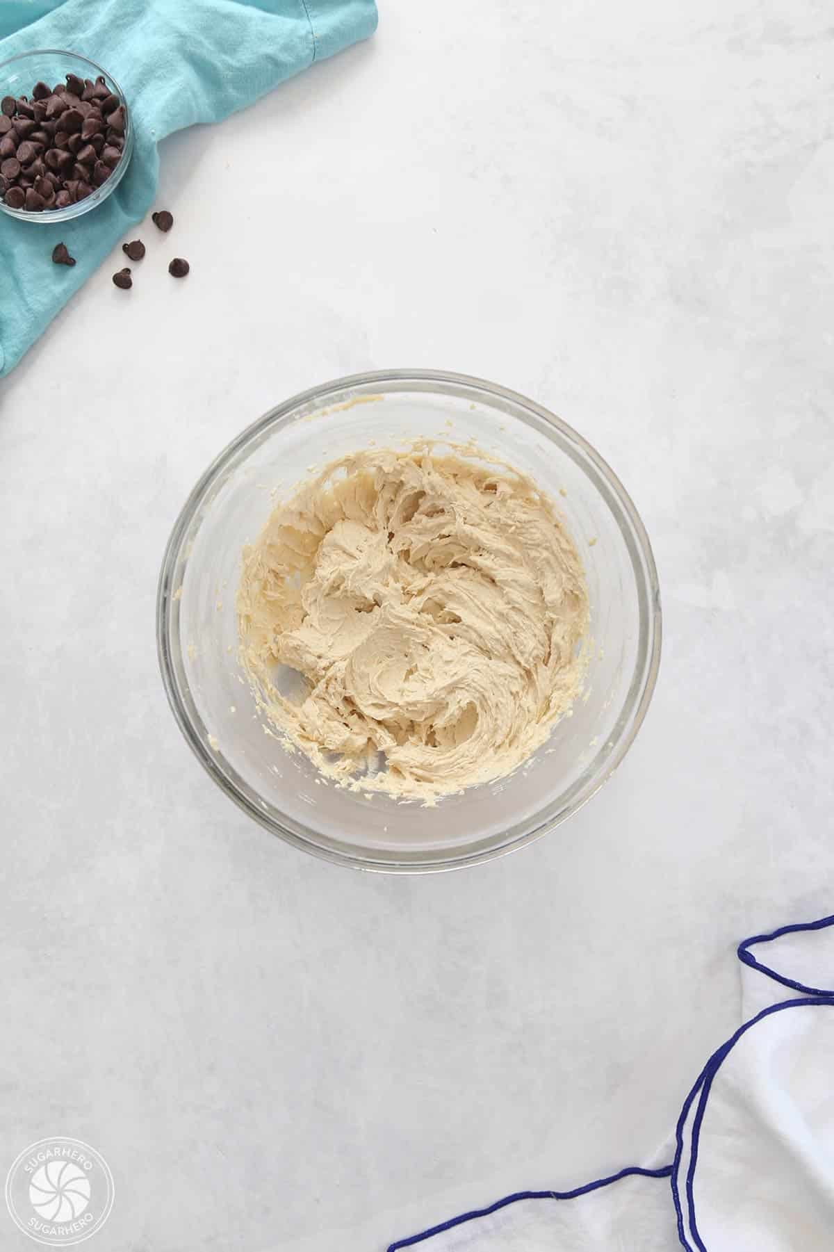 Cookie dough frosting in a clear glass bowl.