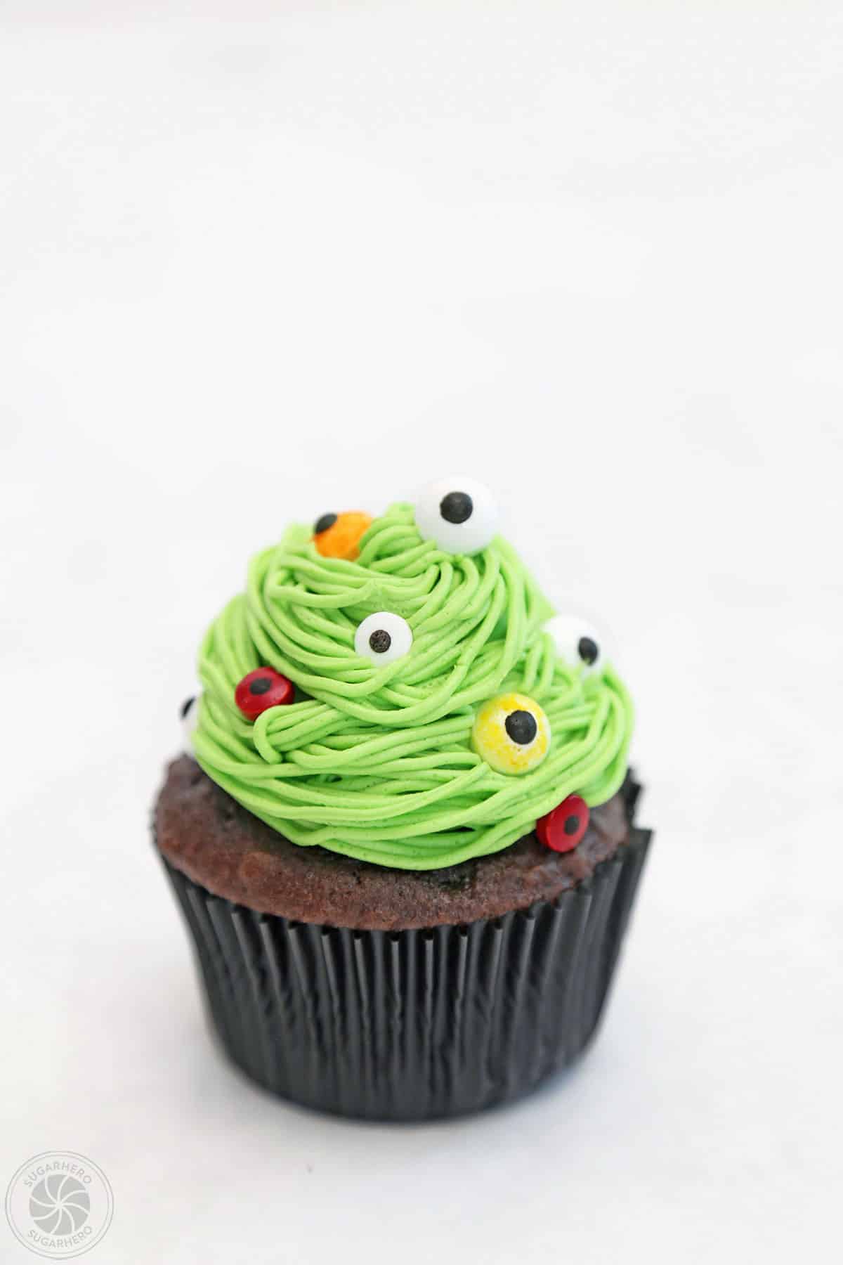 Close up of a green monster cupcake.