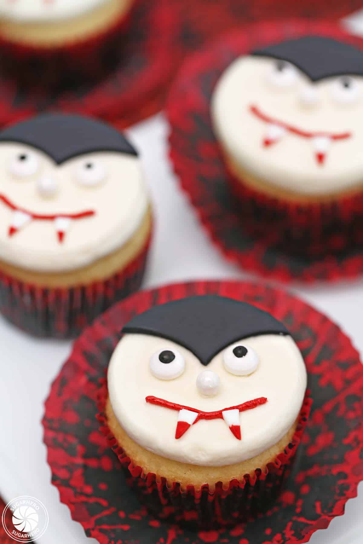 Close up of a Vampire Cupcake with a red and black wrapper.