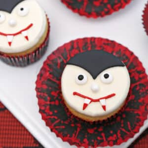 Close up of a vampire cupcake with a red and black wrapper.
