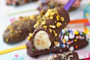 A picture of chocolate-dipped frozen bananas with text overlay for Pinterest.