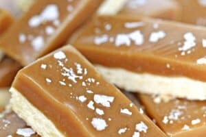 A photo of salted caramel bars with text overlay for Pinterest.