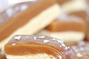 A photo of salted caramel bars with text overlay for Pinterest.