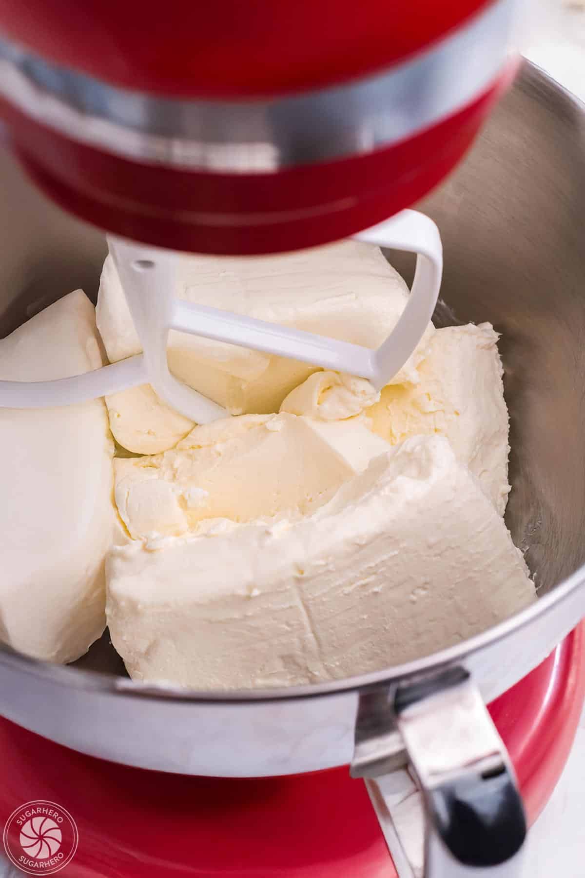 Cream cheese in a red mixer.