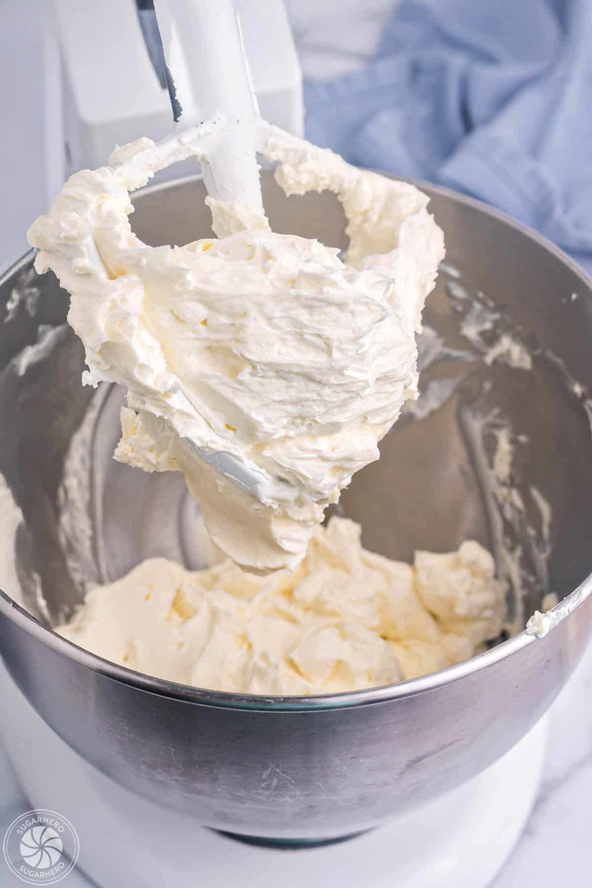 Whipped cream cheese in a mixer bowl.