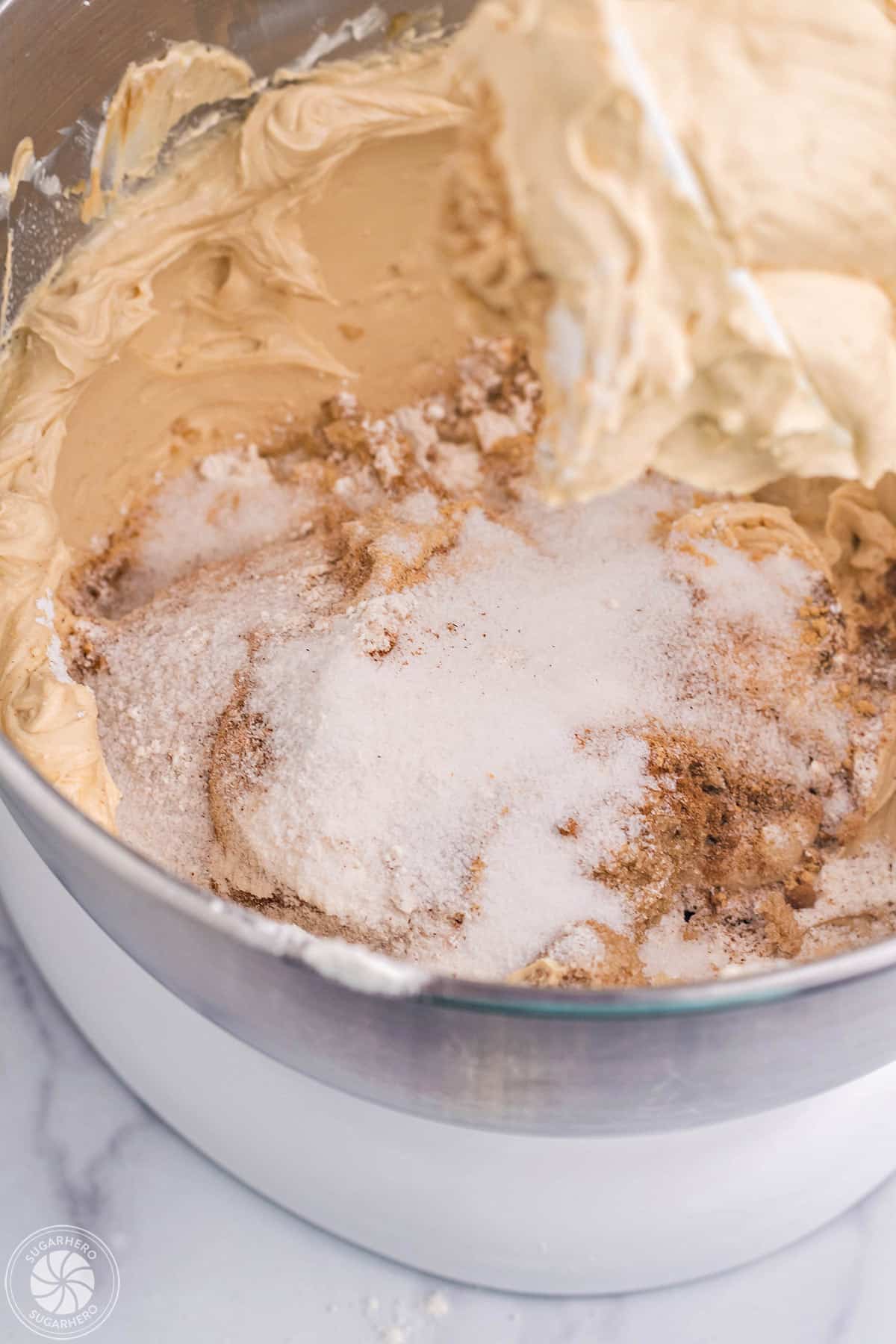 Sugar, flour, and spices added to gingerbread cheesecake filling.