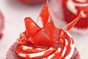 An image of bloody glass cupcakes with text overlay for Pinterest.