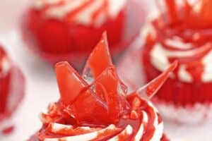 An image of bloody glass cupcakes with text overlay for Pinterest.