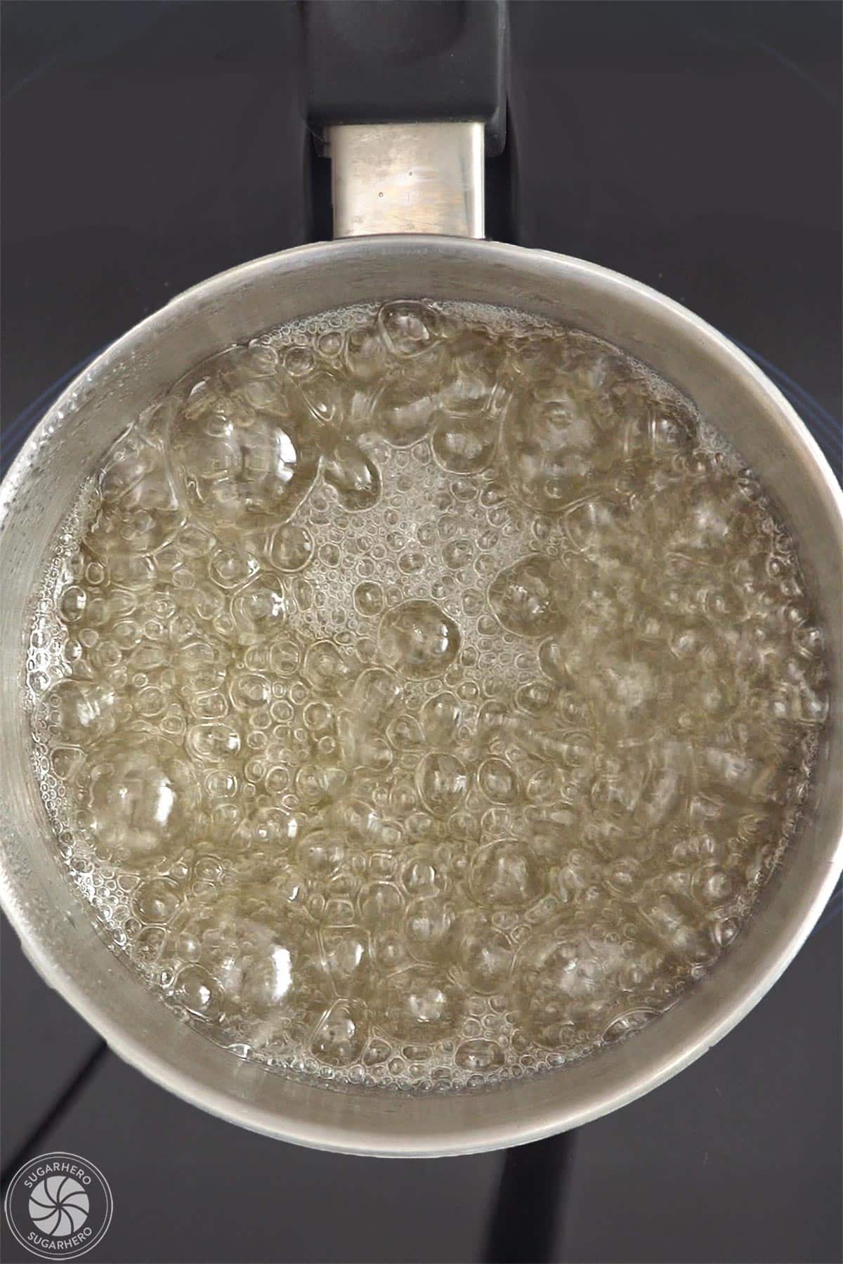 A pot of boiling sugar syrup.