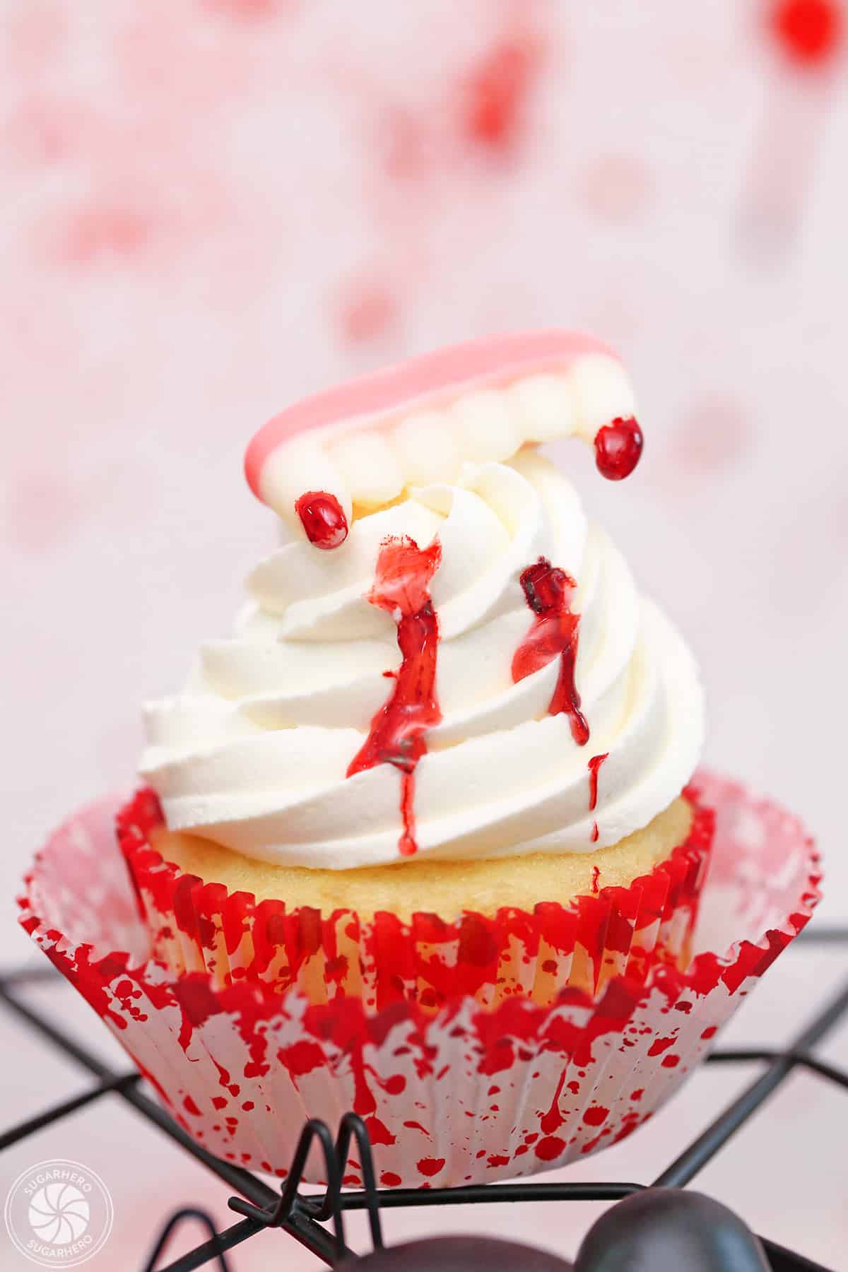 Close up of a vampire bite cupcake.