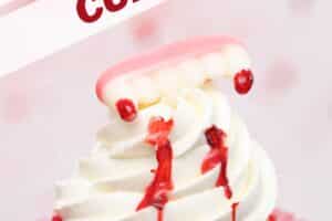 An image of a vampire bite cupcake with text overlay for Pinterest.