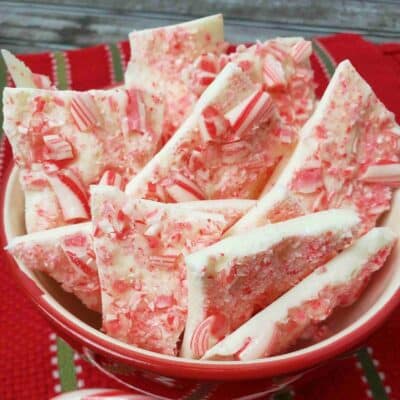 A bowl of peppermint candy cane bark in a pretty bowl.