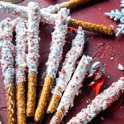 Peppermint white chocolate pretzels spread out in a small pile.