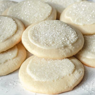 Several peppermint white chocolate sugar cookies in a pile.