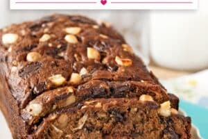 An image of banana coconut macadamia nut bread with text overlay for pinterest.
