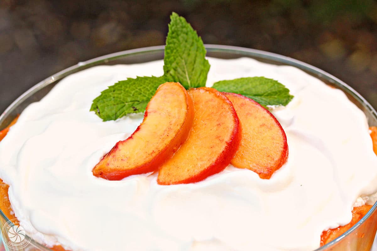 Close up of the top of a peaches and cream trifle.